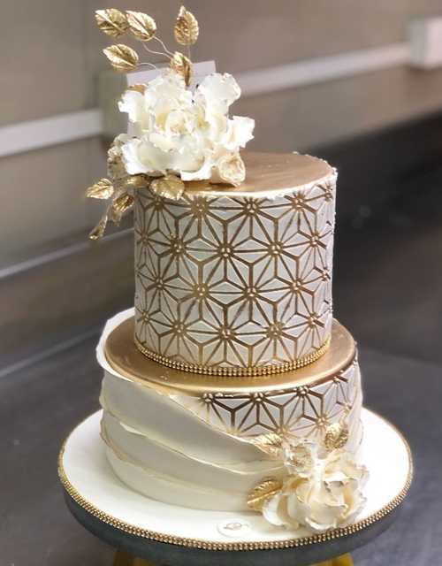 A big beautiful cake with small cakes stands on the festive table Stock  Photo | Adobe Stock